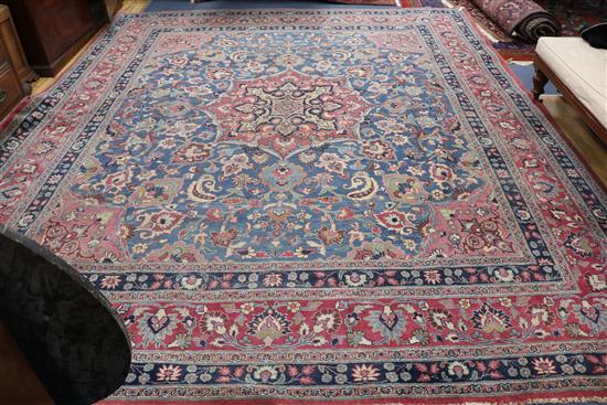 A large Heriz blue ground carpet, multi-bordered, 400 x 315cm